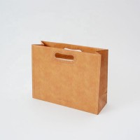 China Fashion Luxury Orange Color Paper Bag with Retro Die Cut Hole Carrying